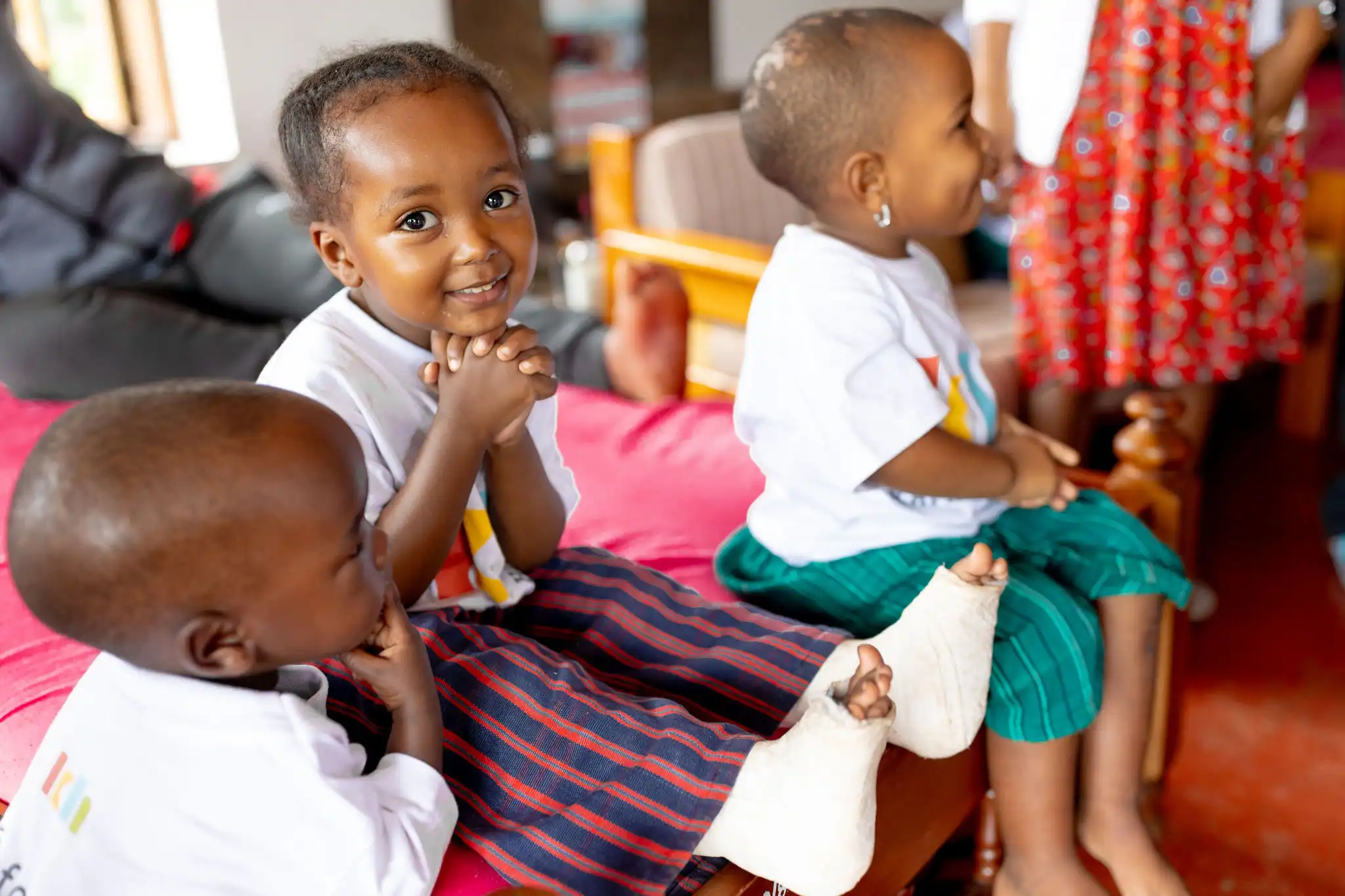 Employees at Kafika House helping children